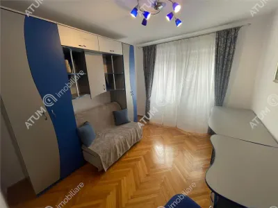 De inchiriat apartament cu 3 camere decomandate si balcon in zona Vasile Aaron din Sibiu - foto 8